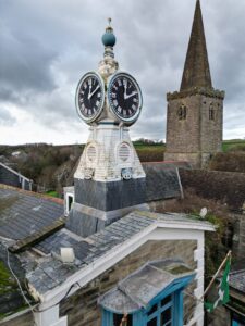 View of town hall roof and clock tower with St Edmonds Church Spire behind, image taken by drone
