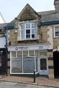 two flats above a shop at 57 Fore Street next to the Market Hall