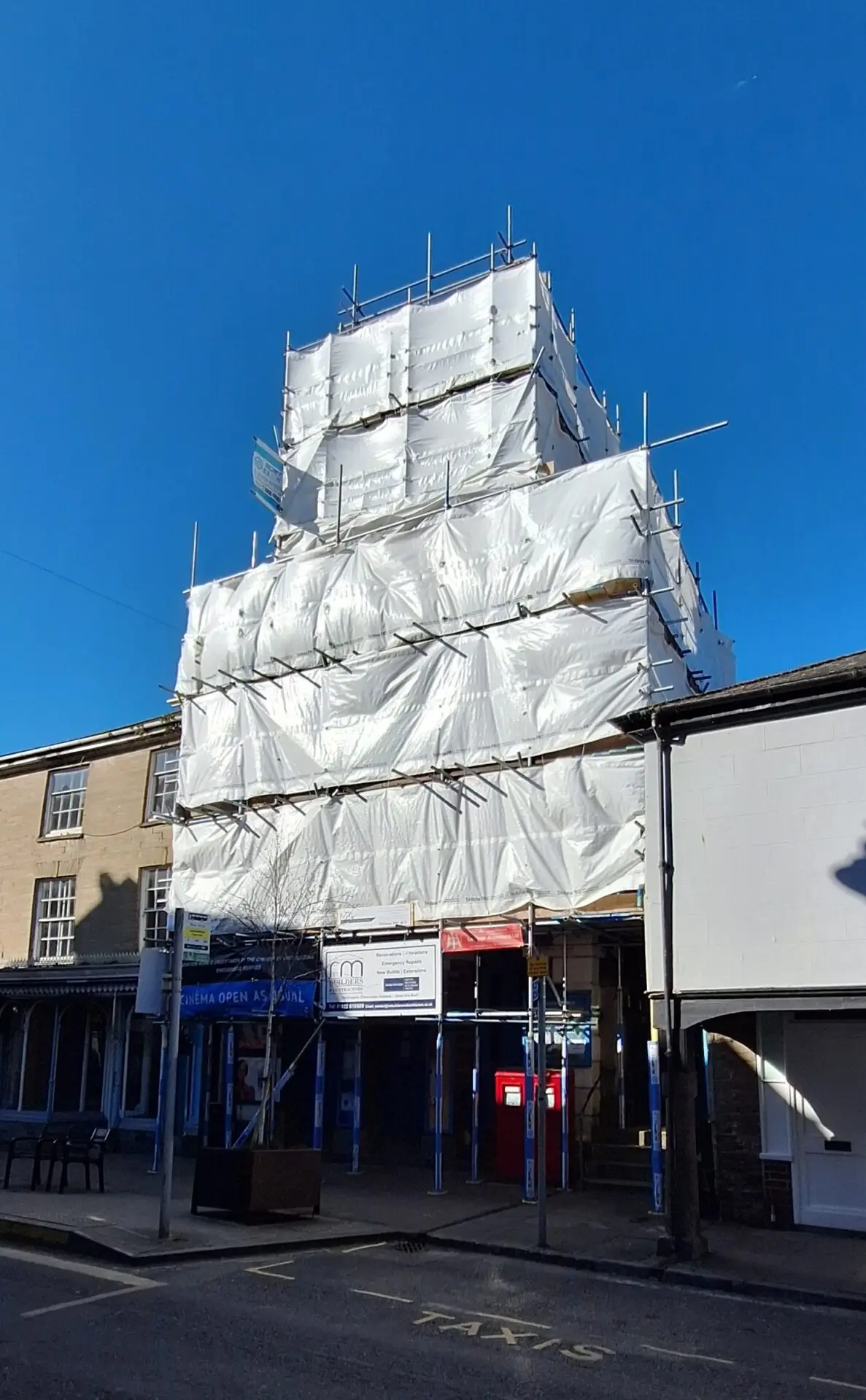 Town Hall covered with scaffold and plastic sheeting March 2025