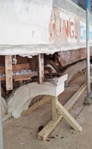 photo of rotten wood and cracked fascia just under the Kings Cinema logo on the Town Hall building
