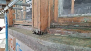 photo shows blue paint removed from the woodwork around the windows above the Town Hall Kings Cinema logo